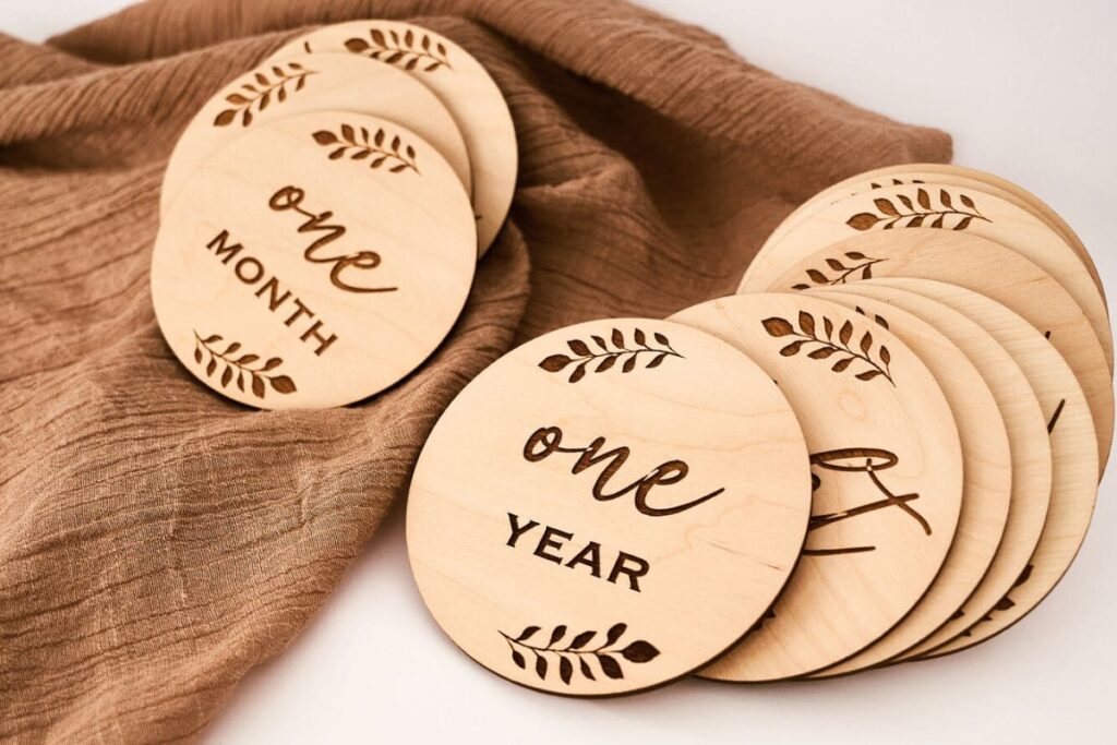 An assortment of laser-cut signs arranged on a table.