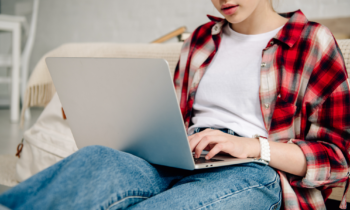 Female teen making money from home on her laptop