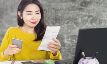 Woman scanning receipts with her phone