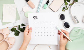 Woman using sales trends calendar to plan marketing strategy for her eBay selling business