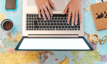 Woman working on a laptop as a wok from home travel agent