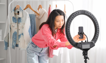 Young Asian woman getting ready to record a video for TikTok