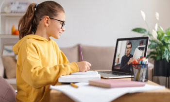 Young female student attending an online tutoring session