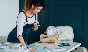 Artist working from home wear overalls