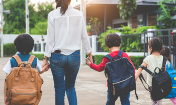 mom bringing her children to school